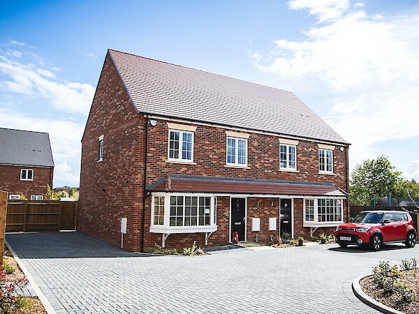house with red car