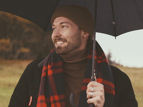 man holding umbrella